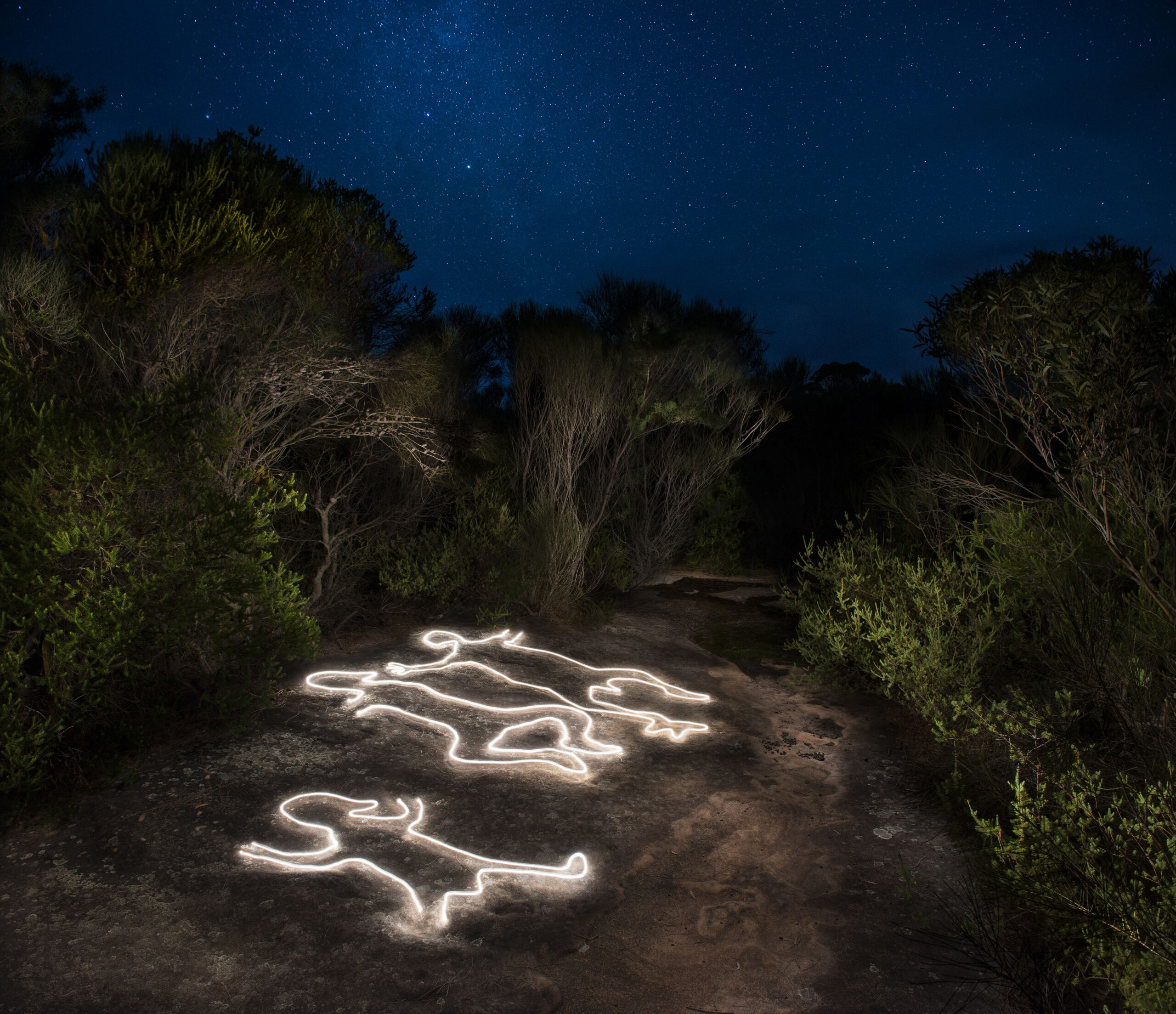An engraving site illuminated after dark